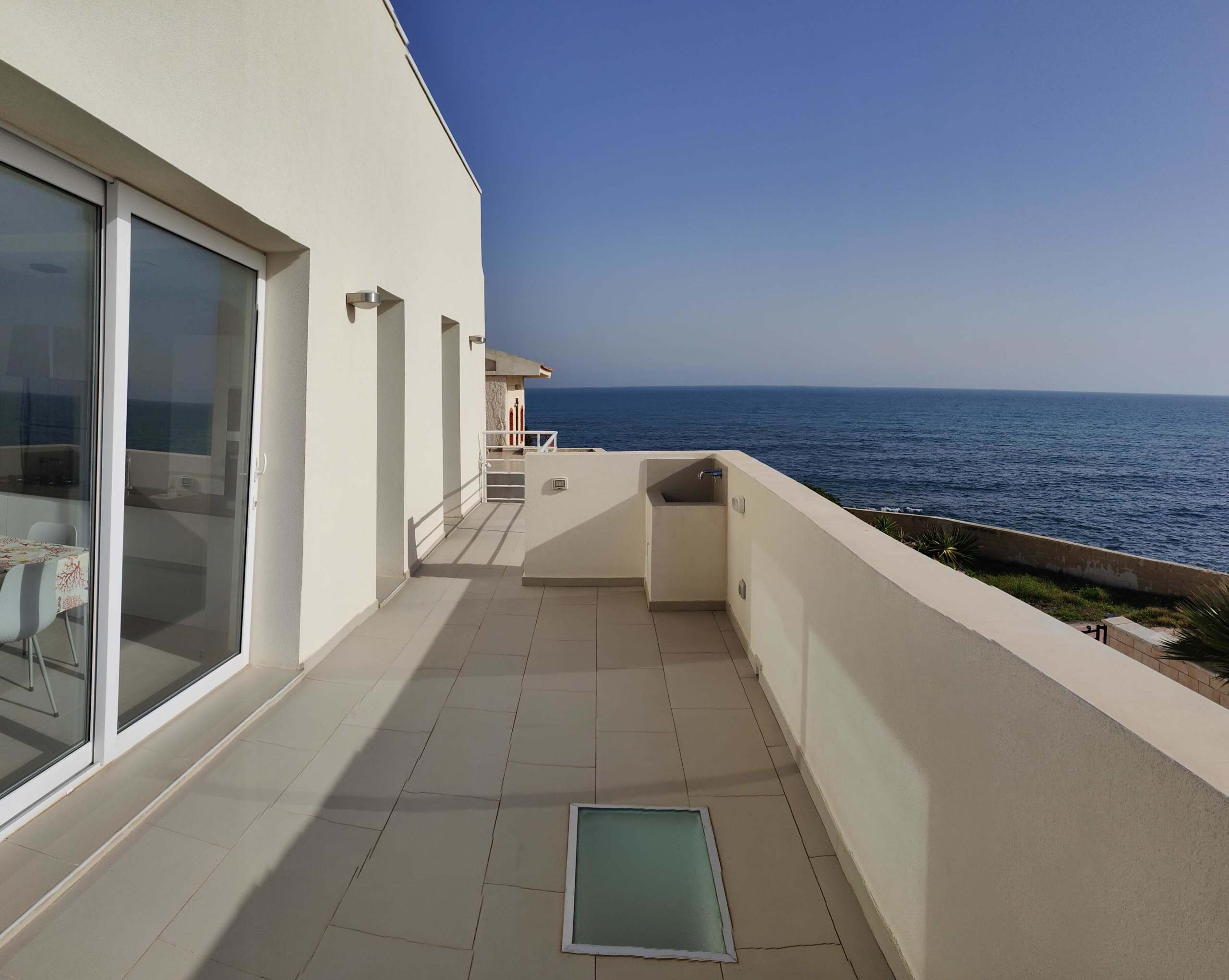 For sale "The waves of Cicirata" seaside villa in Avola with three apartments with sea view