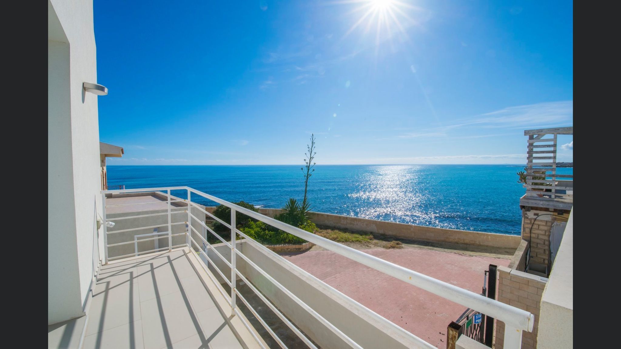 For sale "The waves of Cicirata" seaside villa in Avola with three apartments with sea view